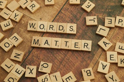 Arranged letters forming 'words matter' on scrabble tiles