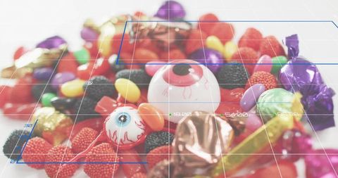 Novelty candy eyeballs and colorful jelly beans with augmented reality grid overlay