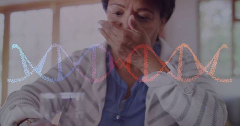 Elderly woman consuming medication with dna overlay