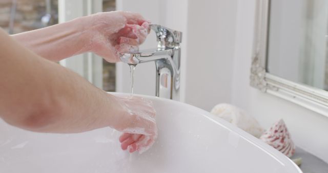 Person Washing Hands with Soap in Modern Bathroom - Download Free Stock Images Pikwizard.com