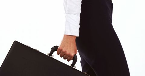 Professional businessman holding briefcase ready for work