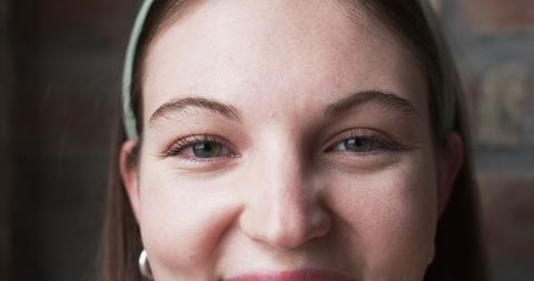 Portrait Close-Up of Smiling Caucasian Female at Work