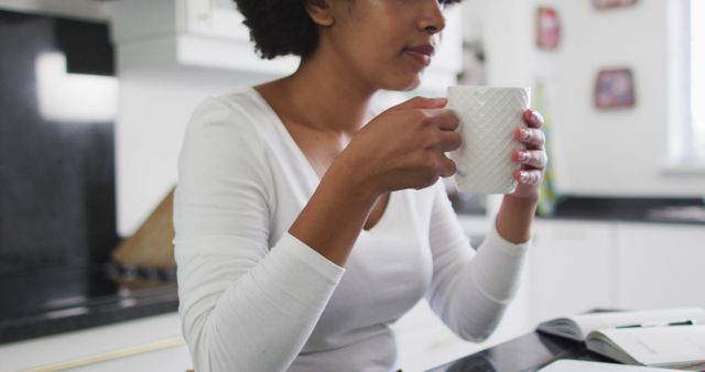 Woman Enjoying Coffee in Modern Kitchen - Download Free Stock Images Pikwizard.com