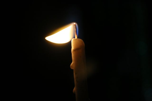 Single Candle Flame in Dark Surroundings Illuminating Warm Glow - Download Free Stock Photos Pikwizard.com