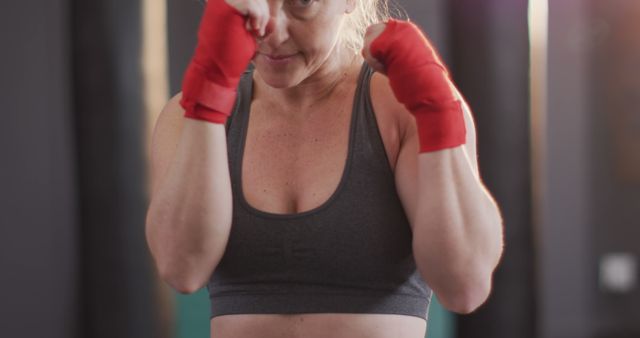 Close up of caucasian female boxer practicing her punches at the gym - Download Free Stock Photos Pikwizard.com