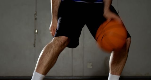 Basketball Player Dribbling Orange Ball in Gymnasium - Download Free Stock Images Pikwizard.com