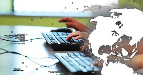 Two Hands Typing on Wired Keyboards with Globe Overlay for Teamwork and Data Collaboration