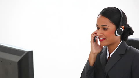 Confident Businesswoman Using Headset in Office Environment