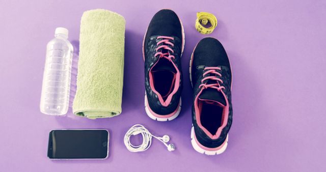 Fitness Essentials on Purple Background with Sneakers Water Bottle and Towel - Download Free Stock Images Pikwizard.com