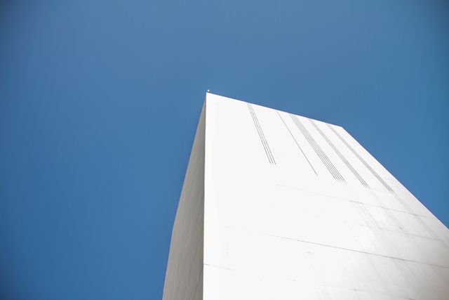 Modern Minimalist White Building Against Clear Blue Sky - Download Free Stock Photos Pikwizard.com
