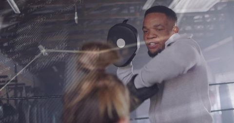 Boxing Trainer Converting Techniques in Intense Coach and Boxer Training