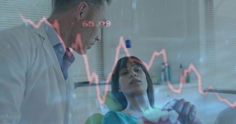Dentist consulting patient in dental clinic holding denture with digital waveform overlay