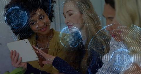 Diverse Team Collaborating on Tablet with Digital Globe Overlay