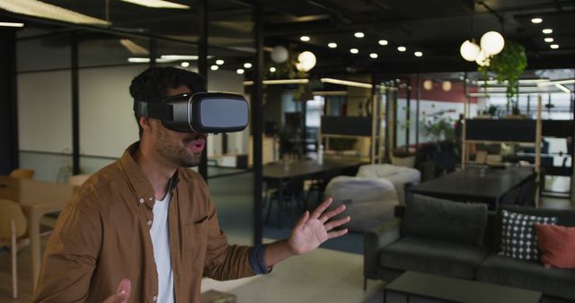 Excited Man Experiencing Virtual Reality in Modern Office - Download Free Stock Images Pikwizard.com