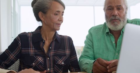 Senior Couple Focused on Online Financial Planning