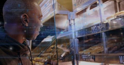 Digital vision: customer studying pastries in modern bakery