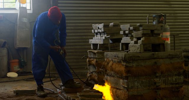 Industrial Worker Controlling Liquid Metal Pouring in Foundry - Download Free Stock Images Pikwizard.com