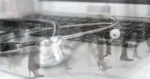 Stethoscope on Keyboard with Overlapping Business People Silhouettes