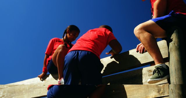 Team of Young Adults Overcoming Obstacle Course - Download Free Stock Images Pikwizard.com