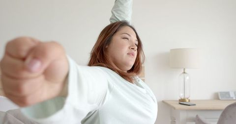 Happy Biracial Woman Stretching Morning Routine