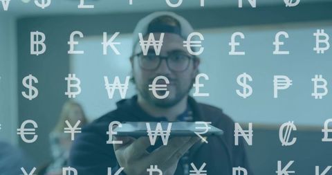 Man holding tablet showing digital currency symbols overlay fintech presentation in office