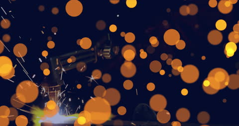 Abstract Light Spots with Welding in Background