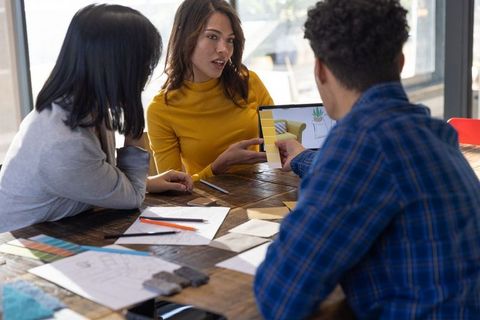 Creative professionals collaborating on interior design project