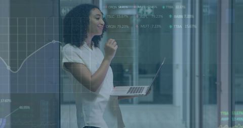 Businesswoman Analyzing Data in Modern Office with Digital Infographics