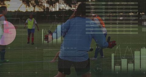 Goalkeeper diving with defensive precision and digital analytics