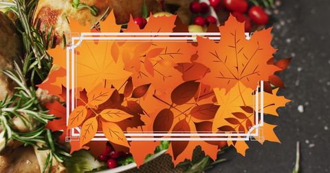 Autumn leaves frame over thanksgiving feast background