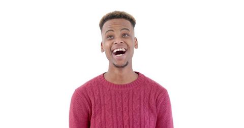 Cheerful Young Man in Red Sweater Expressing Joy - Download Free Stock Images Pikwizard.com