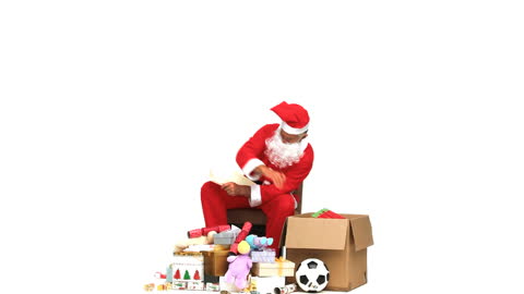 Santa Claus Checking Gifts in Box with Decorations and Toys